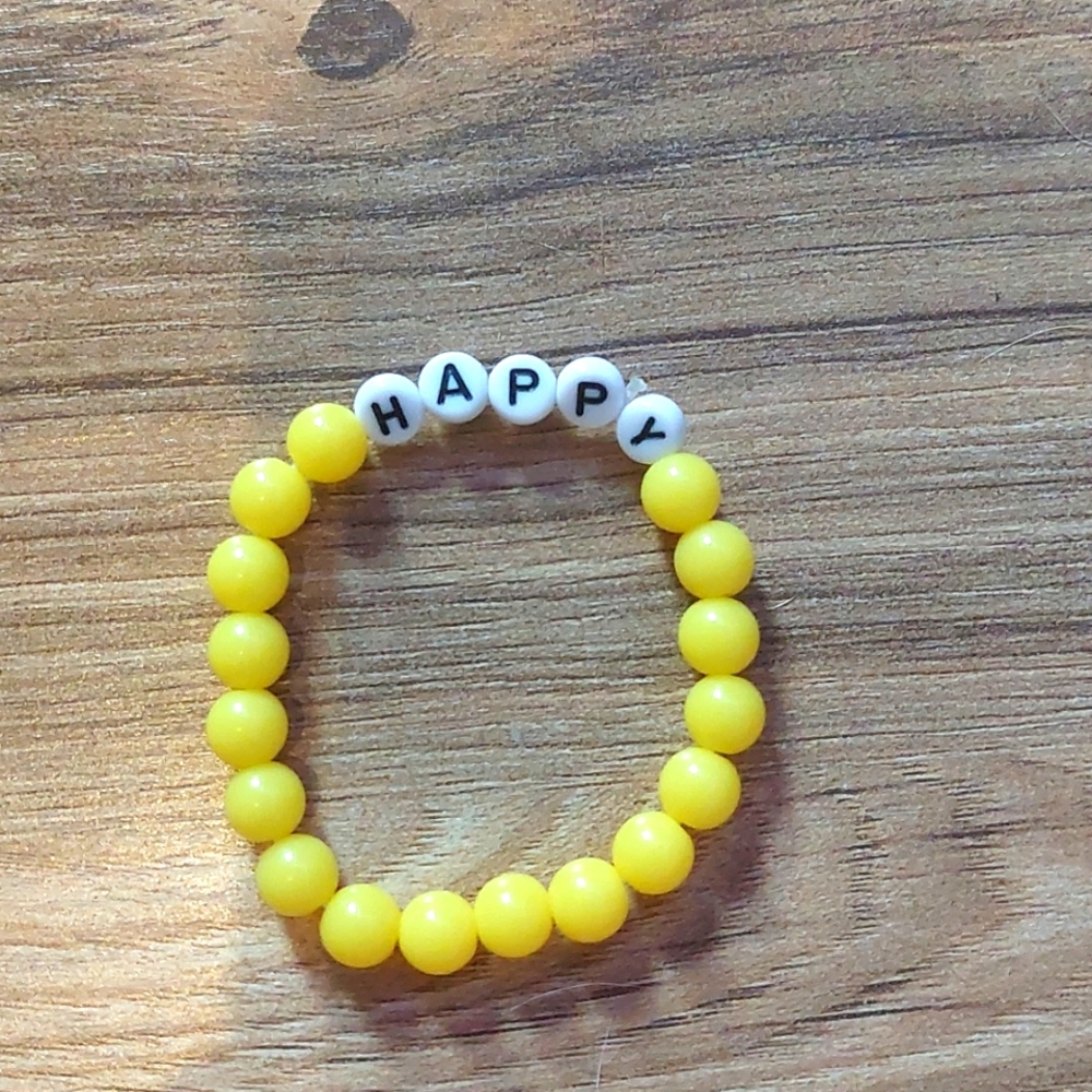 braclet yellow with word happy small